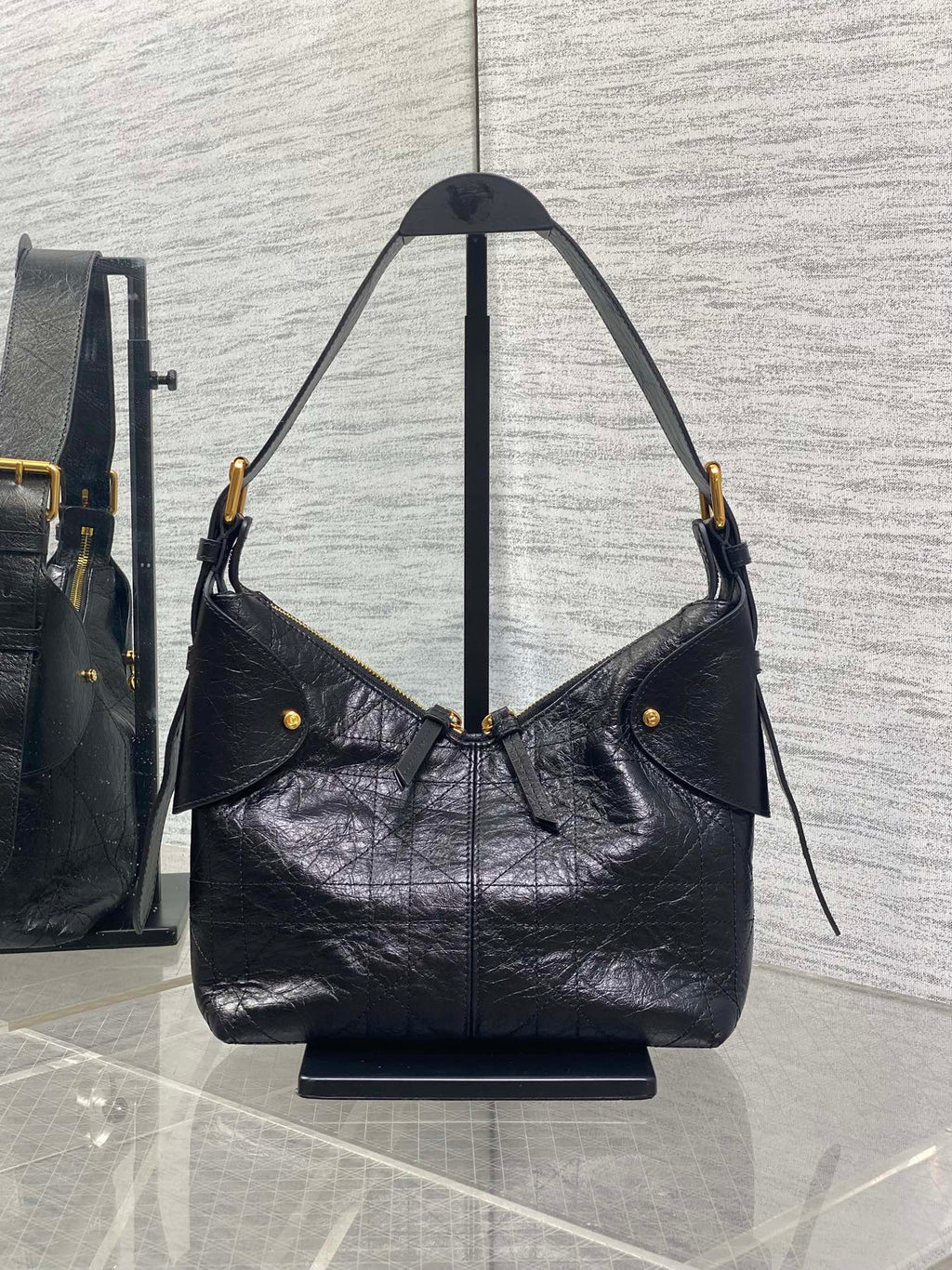 Dior black leather shoulder hobo bag with flap pocket and dangling strap