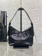 Dior black leather shoulder hobo bag with flap pocket and dangling strap