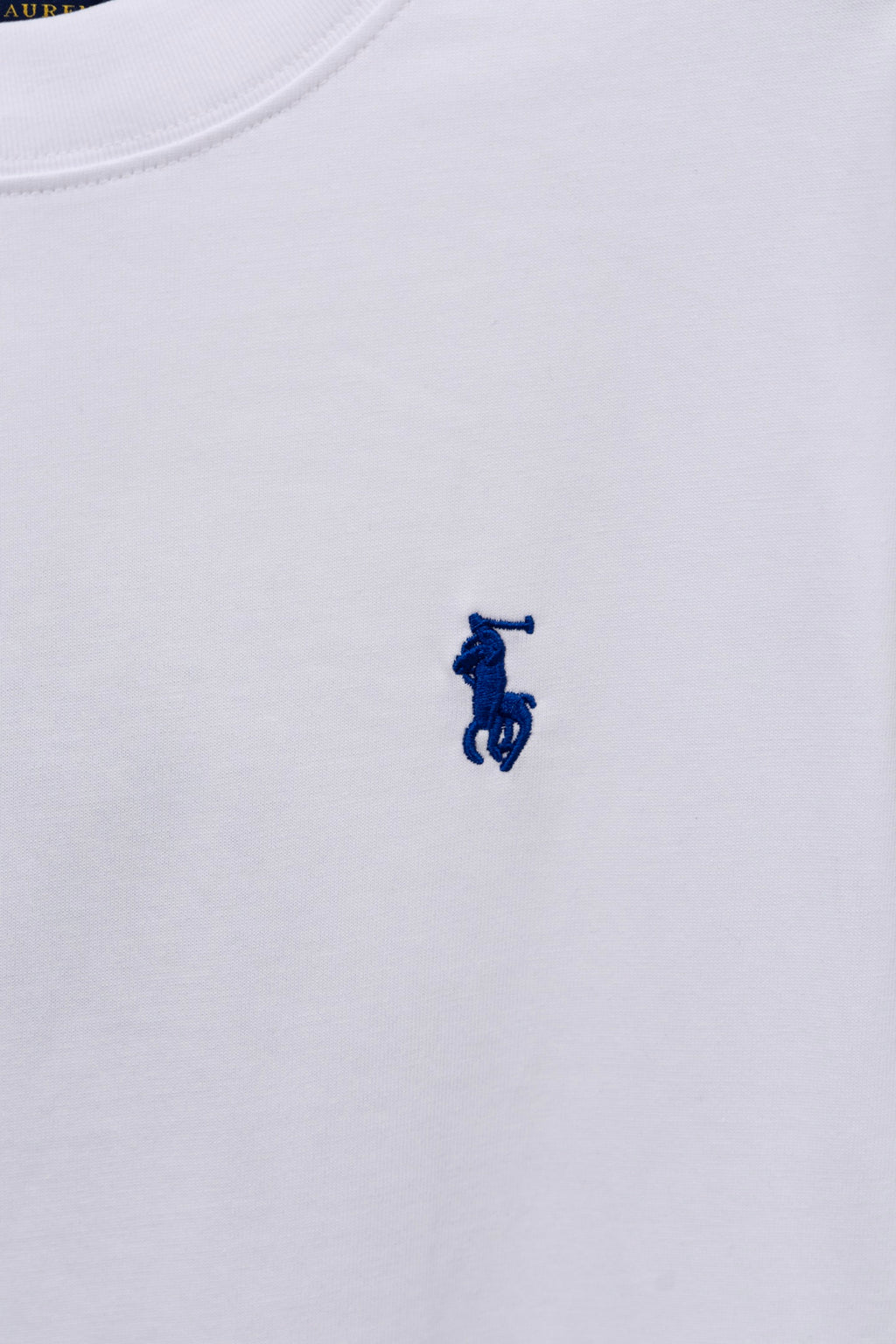 White long-sleeve T-shirt with small blue rider logo