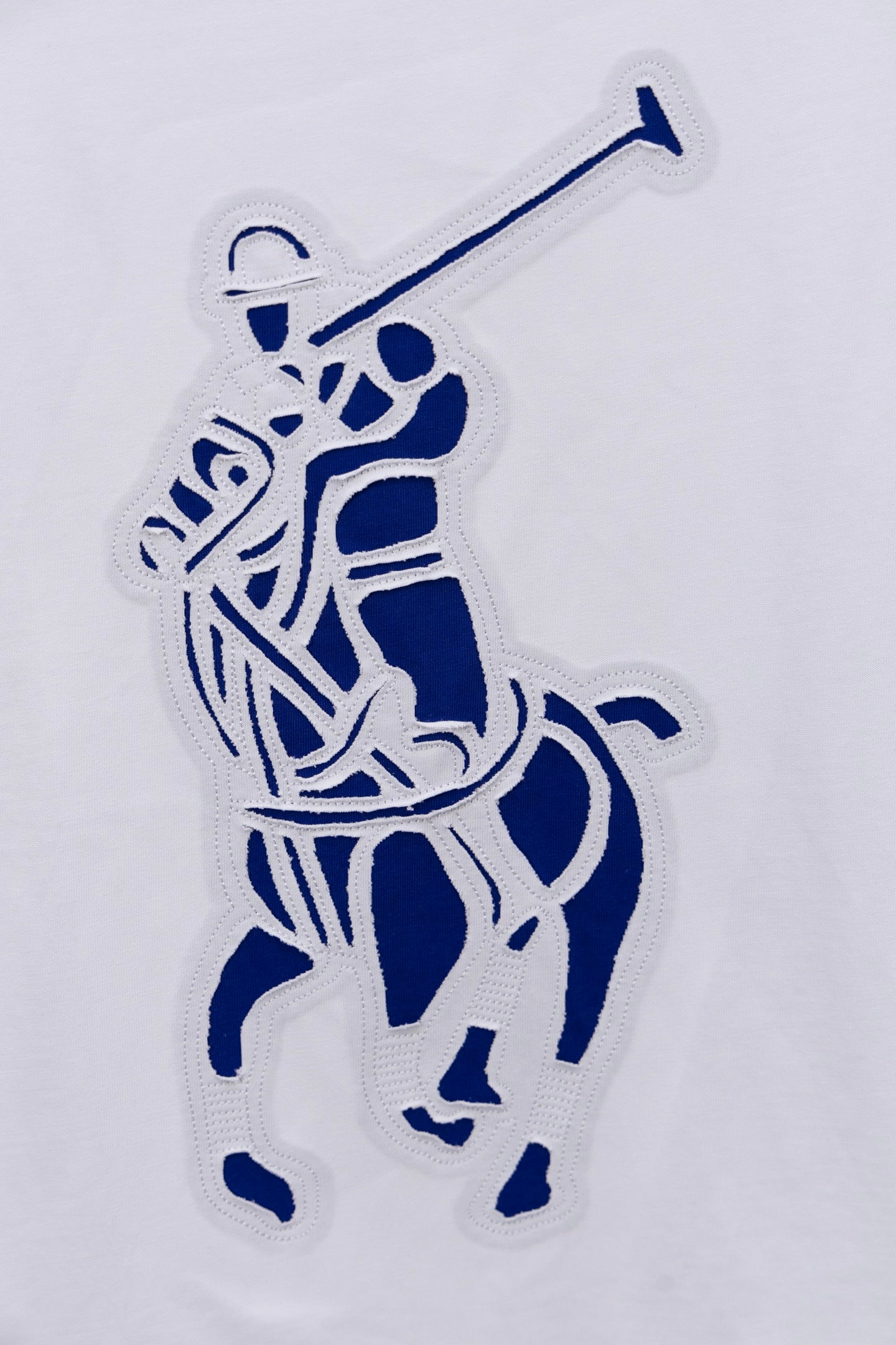 White long-sleeve T-shirt with blue rider graphic applique detail