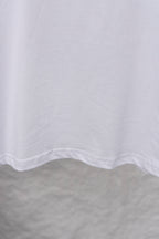 White T-shirt lower hem with curved stitching