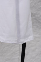 White long-sleeve T-shirt hem and sleeve on hanger