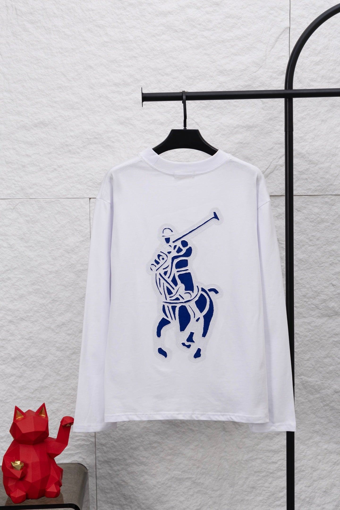 White long-sleeve T-shirt with large blue rider graphic on front