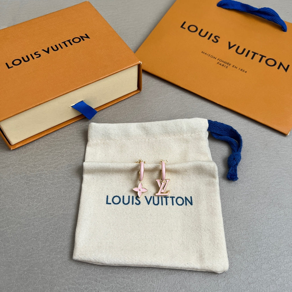 Cream fabric drawstring pouch with blue cord and Louis Vuitton logo, holding charms