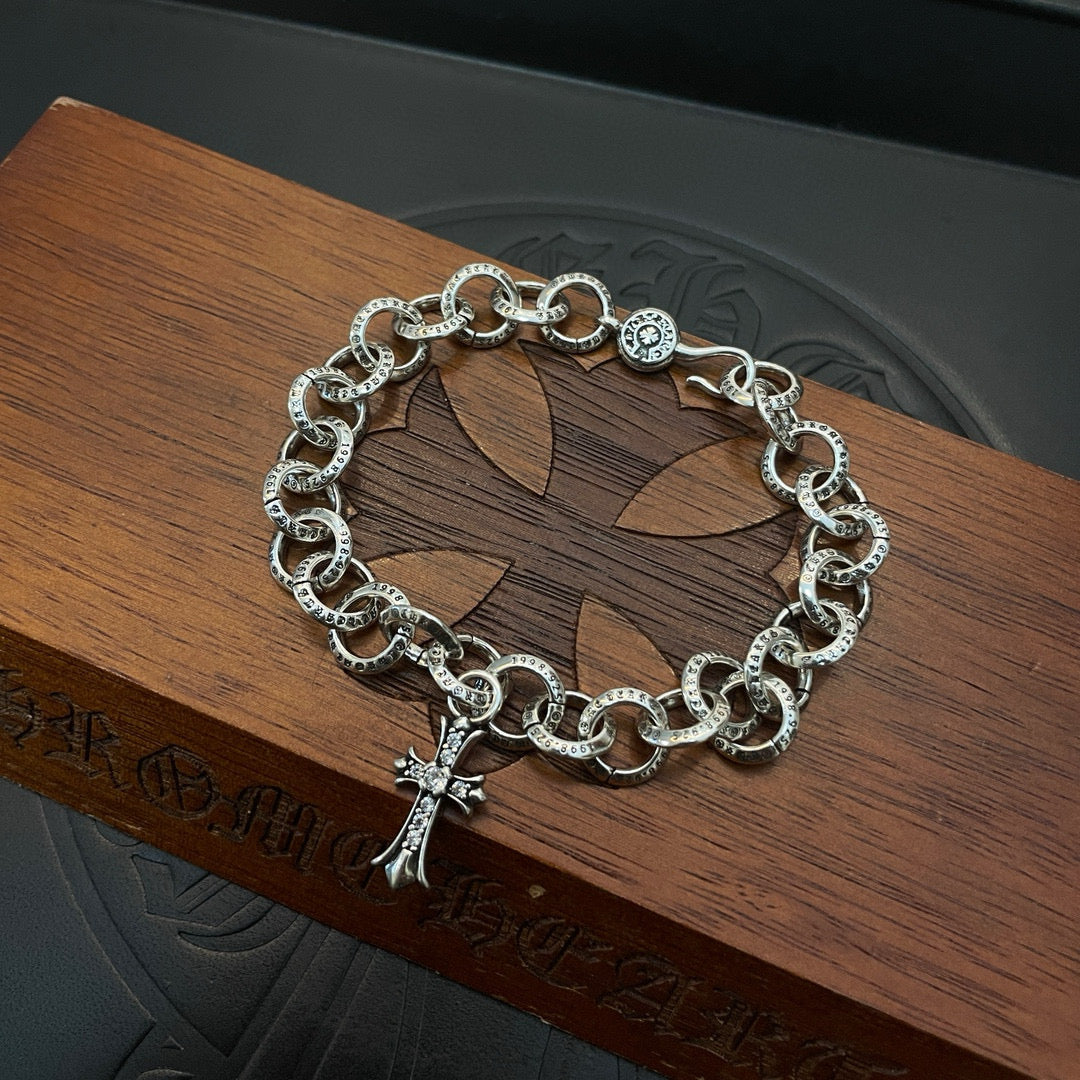 Silver-tone chain bracelet with round links and cross pendant charm