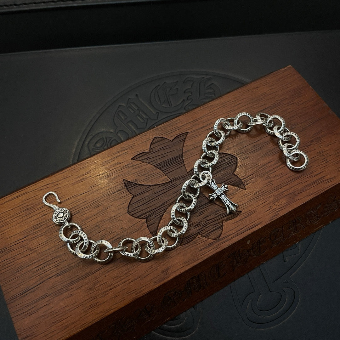 Silver-tone chain bracelet with round links and cross charm