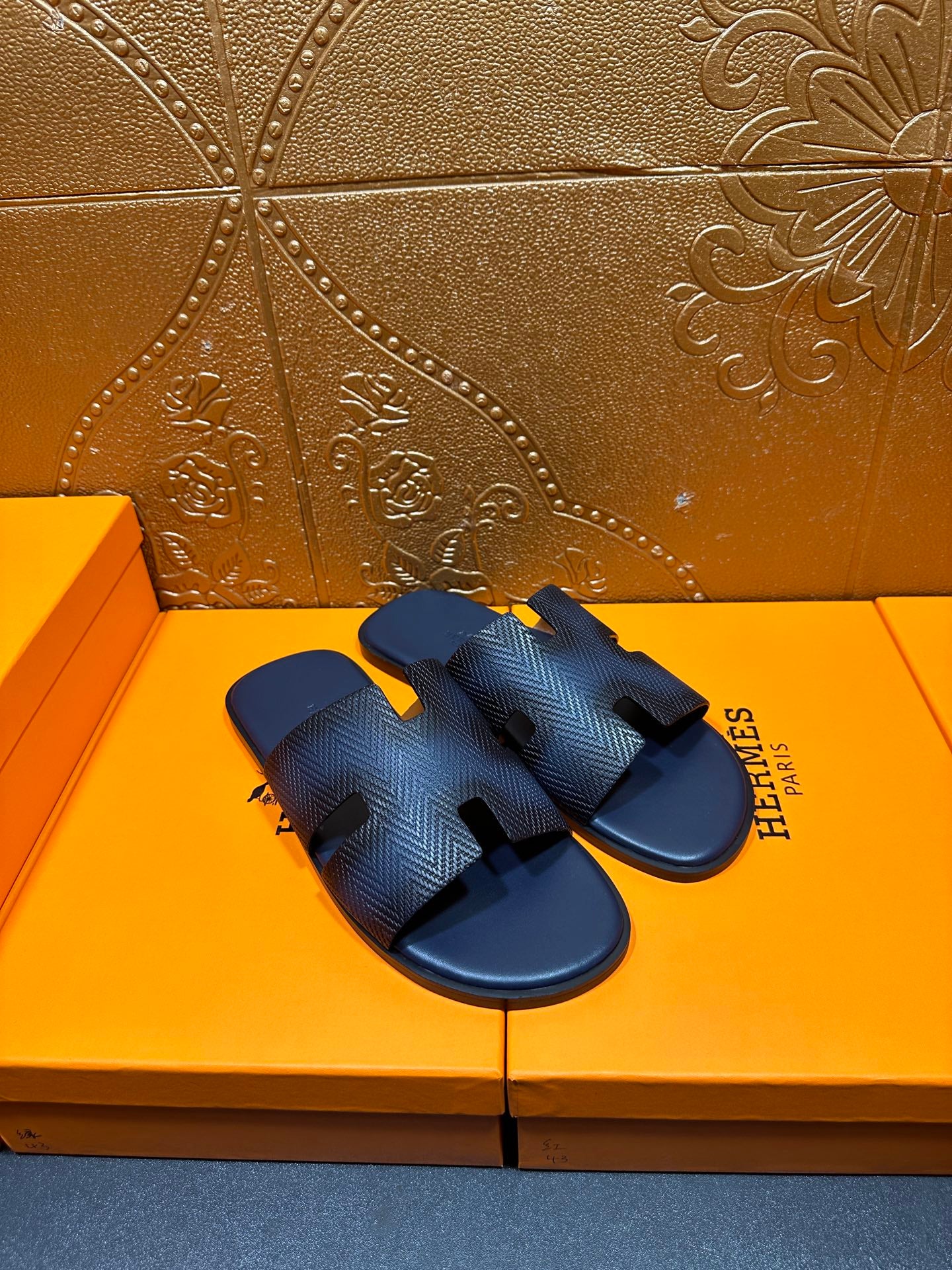 Dark blue textured leather slide sandals, open toe with H-style cutout straps