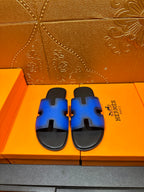 Hermes blue leather sandals with black slide footbed and H-style cutout strap