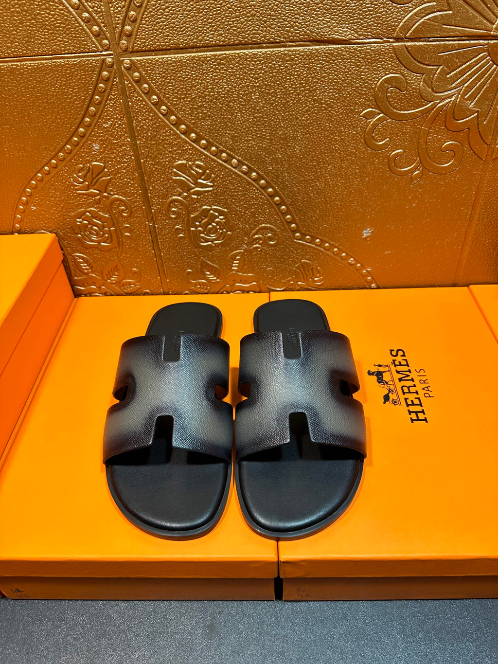 Leather slide sandals with wide adjustable straps and HERMES logo, dark blue.