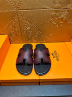 Hermes slide sandals with H cutout straps, dark textured leather, flat footbed