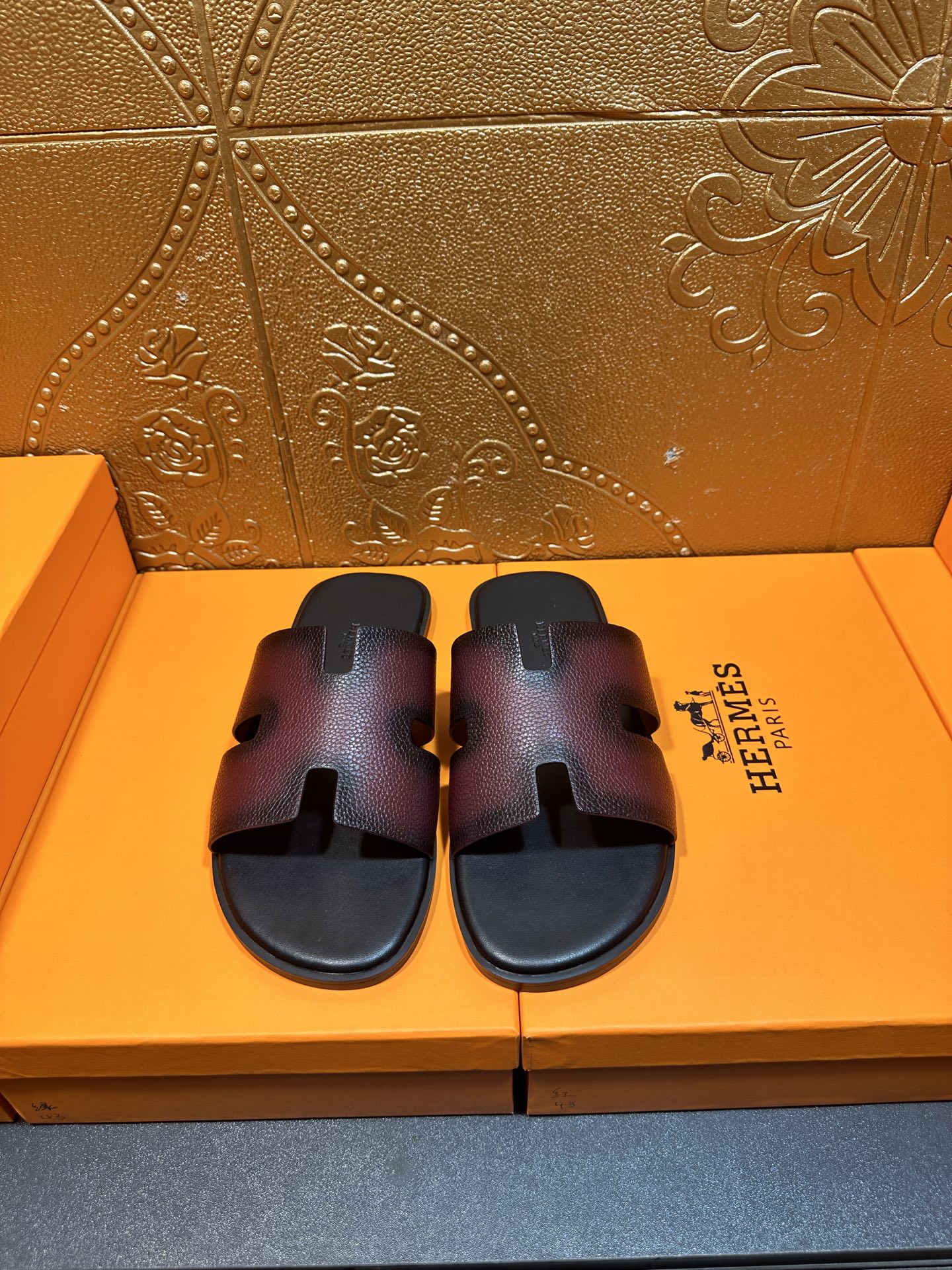 Hermes slide sandals with H cutout straps, dark textured leather, flat footbed