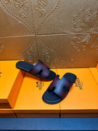 Hermes slide sandals, top view, H cutout straps on dark textured leather