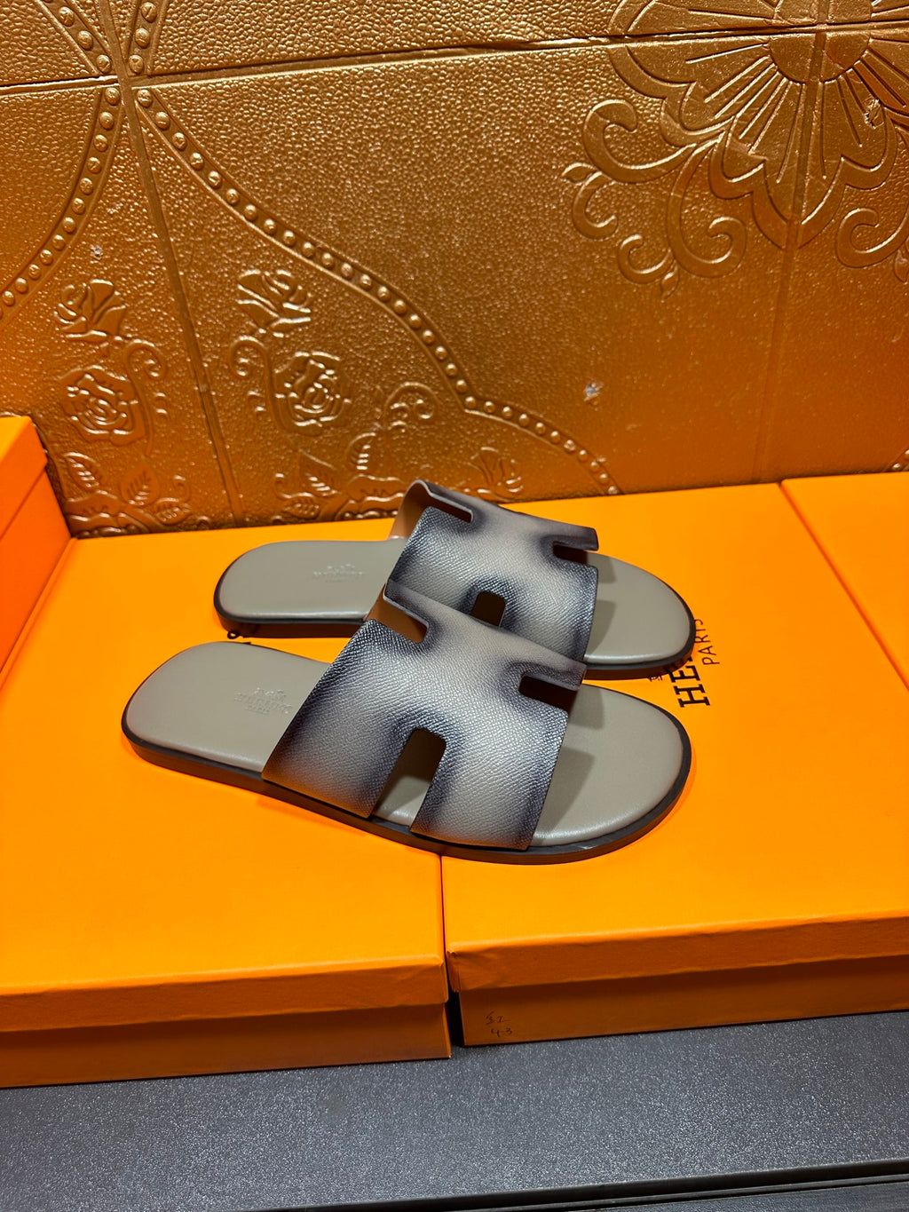 Hermes slide sandals in light blue with side straps and open toe design