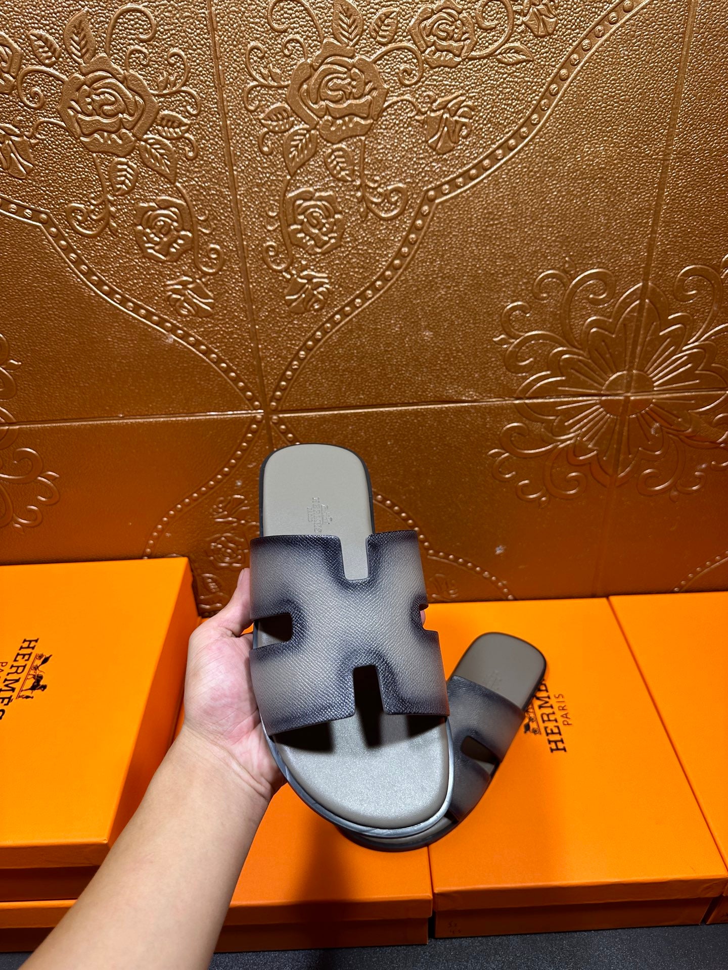 Hermes slide sandals in hand, light blue leather with wide H-style strap