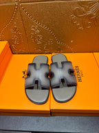 Hermes slide sandals with light blue straps and cutout H-style front