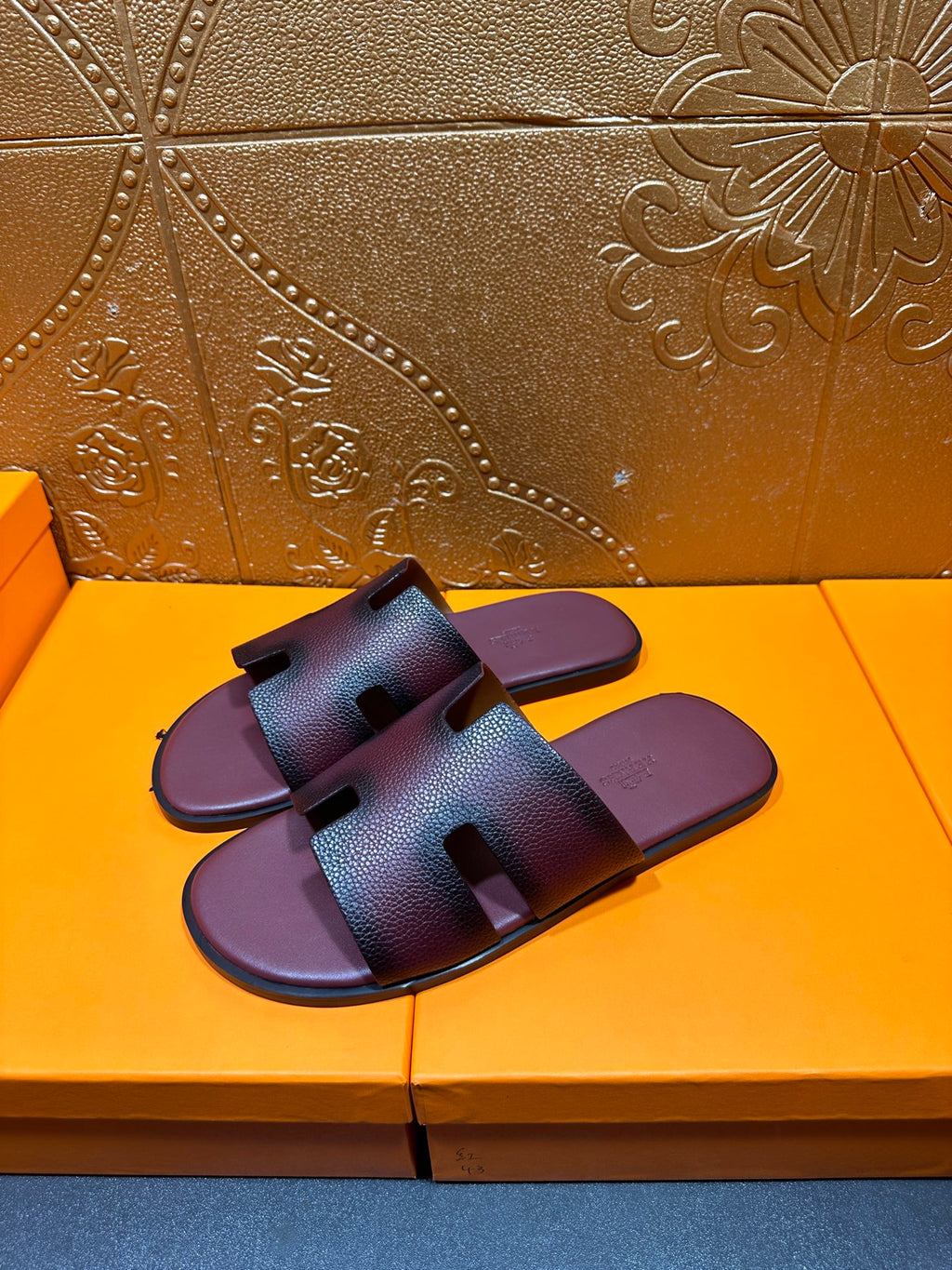 Slide sandals with two wide straps and an H-shaped buckle detail, dark purple