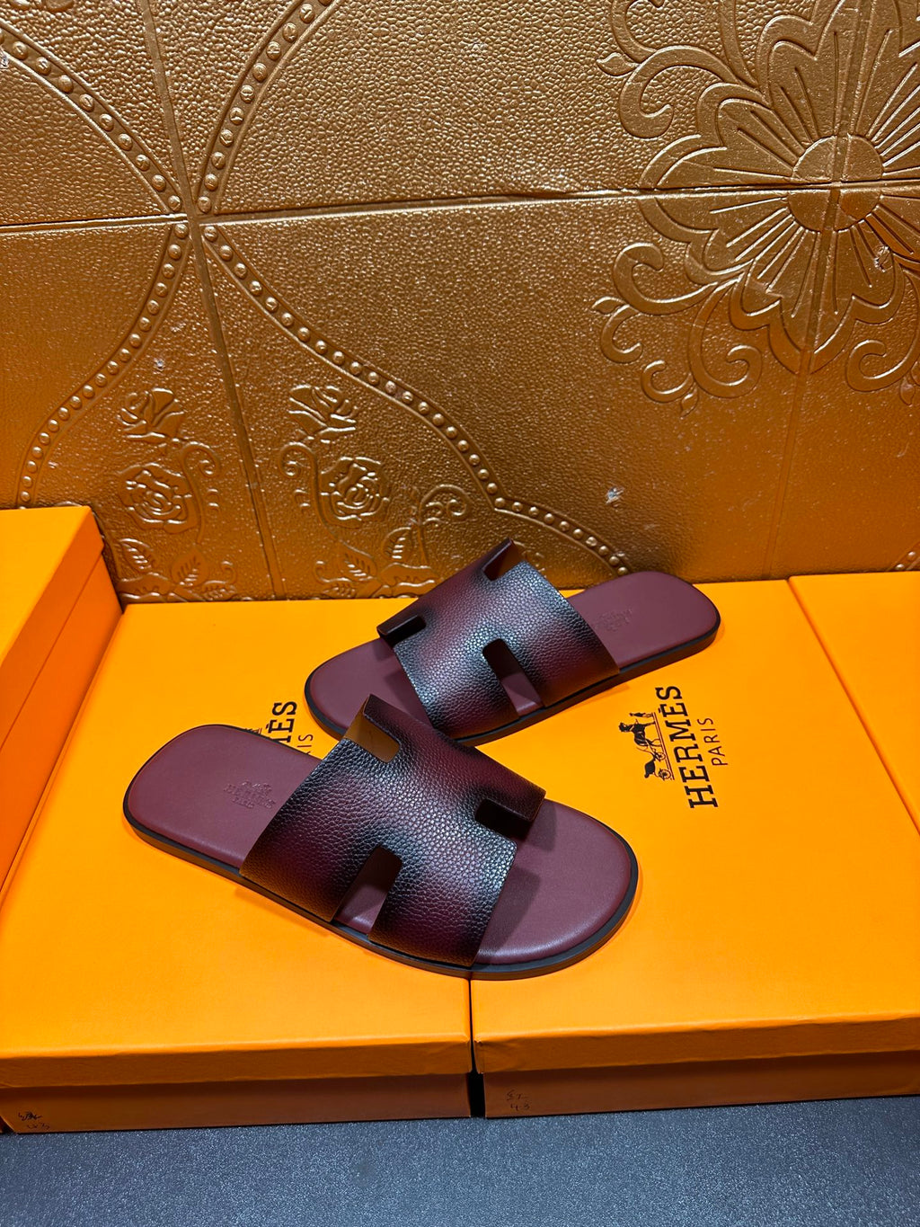 Slide sandals with two-panel straps and dark purple footbed, H buckle detail