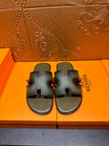 Hermes sandals with wide cross straps, dark blue-green finish, pair on box