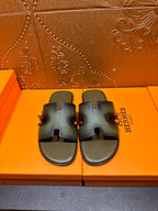 Hermes sandals with wide cross straps, dark blue-green finish, pair on box