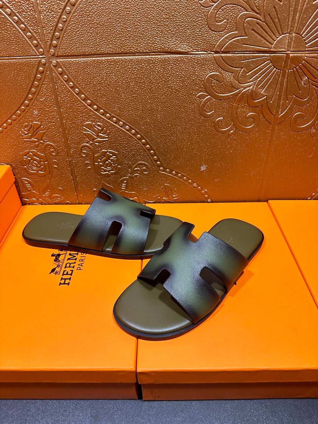 Hermes sandals, blue-green slide with cross straps, pair on orange shoebox