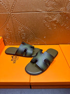 Hermes sandals, blue-green slide with cross straps, pair on orange shoebox