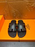 Hermes slide sandals with dark teal leather straps and an open toe