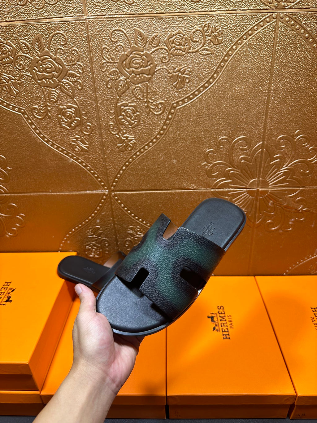 Hermes slide sandal close view, dark teal straps with open toe and contoured sole