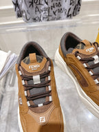 Fendi unisex sneakers close-up: tan upper, dark laces, gray logo patch