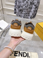 Fendi unisex sneakers rear view: tan uppers with white sole, logo heel detail