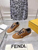 Fendi unisex sneakers in tan with dark laces and white rubber sole, side view