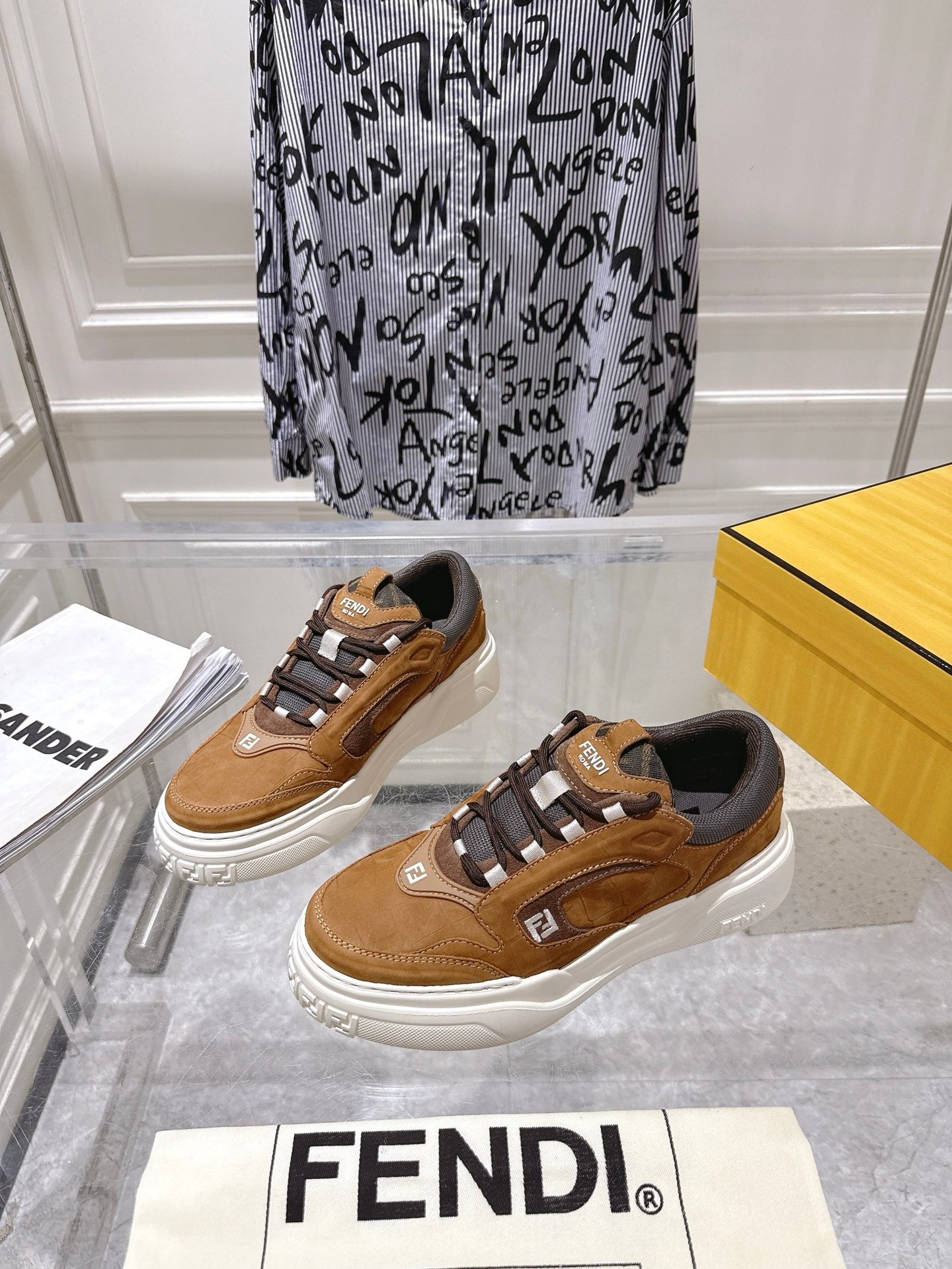 Fendi unisex sneakers in tan with dark laces and white rubber sole, side view