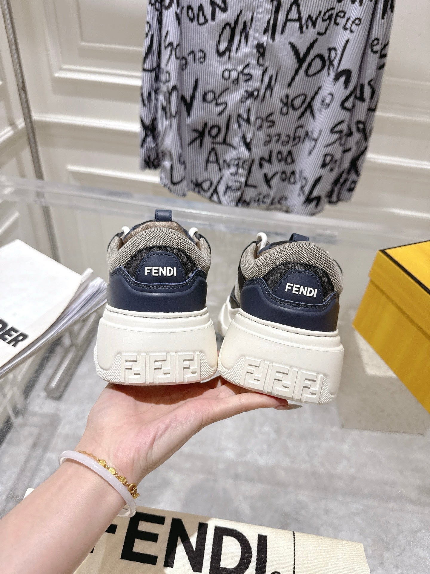 Fendi unisex sneakers heel view showing FENDI embossed on the back