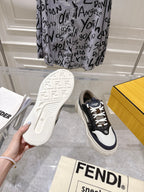 Fendi unisex sneakers outsole and side view, rubber tread with black and white upper