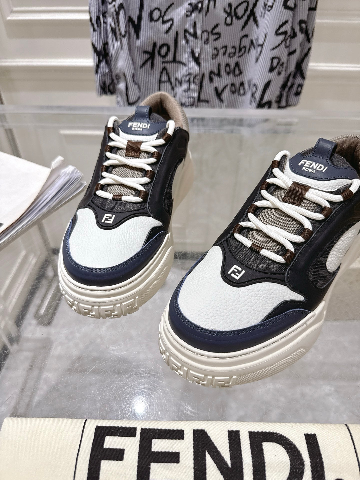 Fendi unisex sneakers front view pair, black and white lace-up with FENDI branding