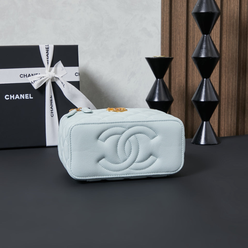 Chanel quilted belt bag, light blue with embossed CC logo and gold chain.