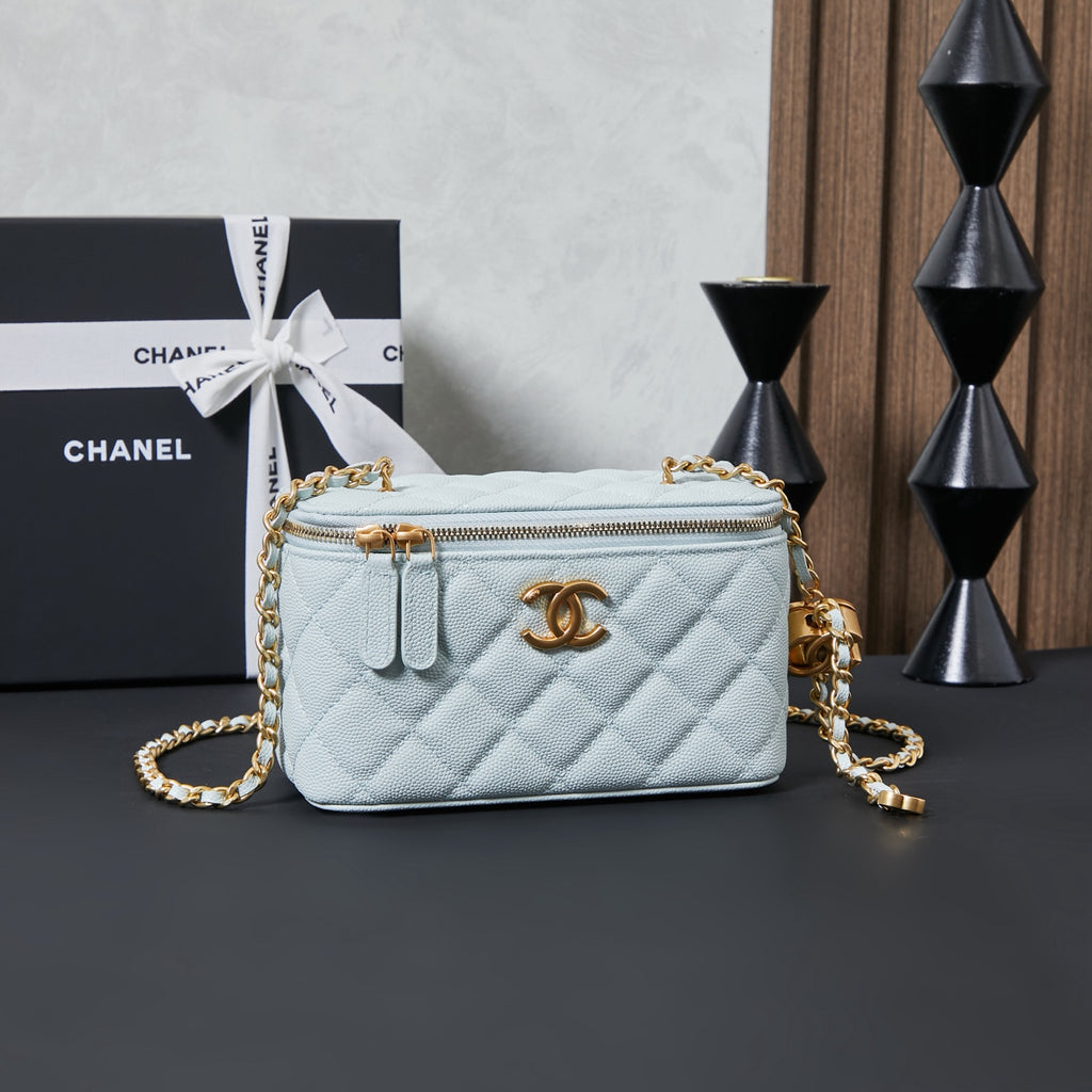 Chanel quilted mini shoulder bag, light blue with gold chain strap and zipper top.