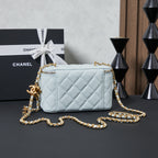 Chanel quilted mini shoulder bag, light blue with gold chain and top zipper.