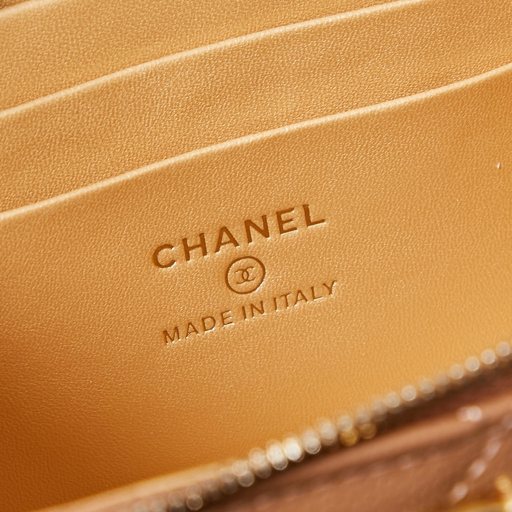 Chanel logo and "MADE IN ITALY" stamp on tan bag lining