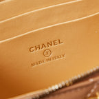 Chanel logo and "MADE IN ITALY" stamp on tan bag lining
