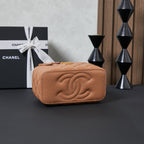 Quilted Chanel mini bag front with embossed CC logo, tan finish
