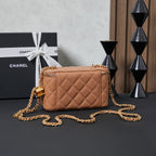 Quilted Chanel mini crossbody bag with gold chain strap, tan finish