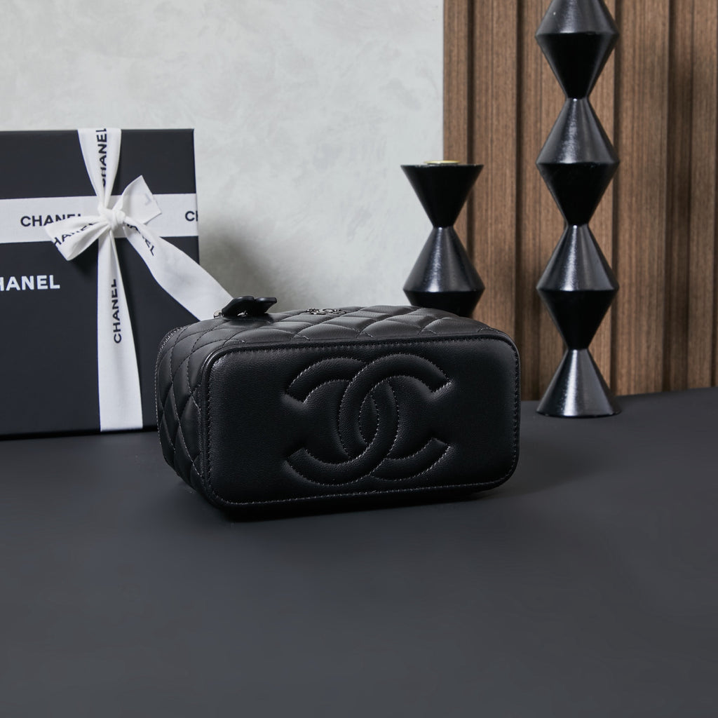 Chanel quilted leather shoulder bag with large CC logo on front, black