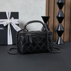 Chanel quilted leather bag with top handle and chain shoulder strap, black