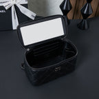 Chanel quilted leather bag open showing inner compartments and zipper, black