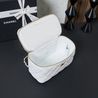 White quilted mini bag open with gold zipper and interior compartments
