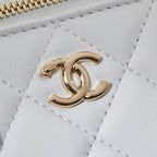 Gold Chanel CC logo on white quilted leather