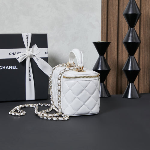 White quilted Chanel mini bag with short chain strap, side view