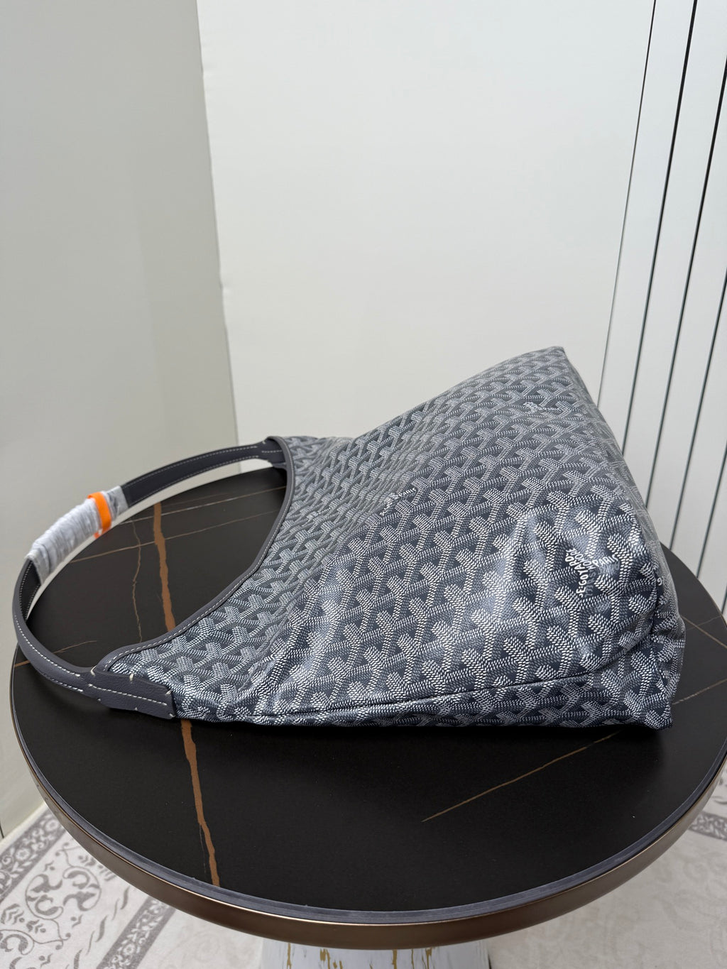 Goyard patterned hobo bag, blue-gray canvas with orange accent and top handles