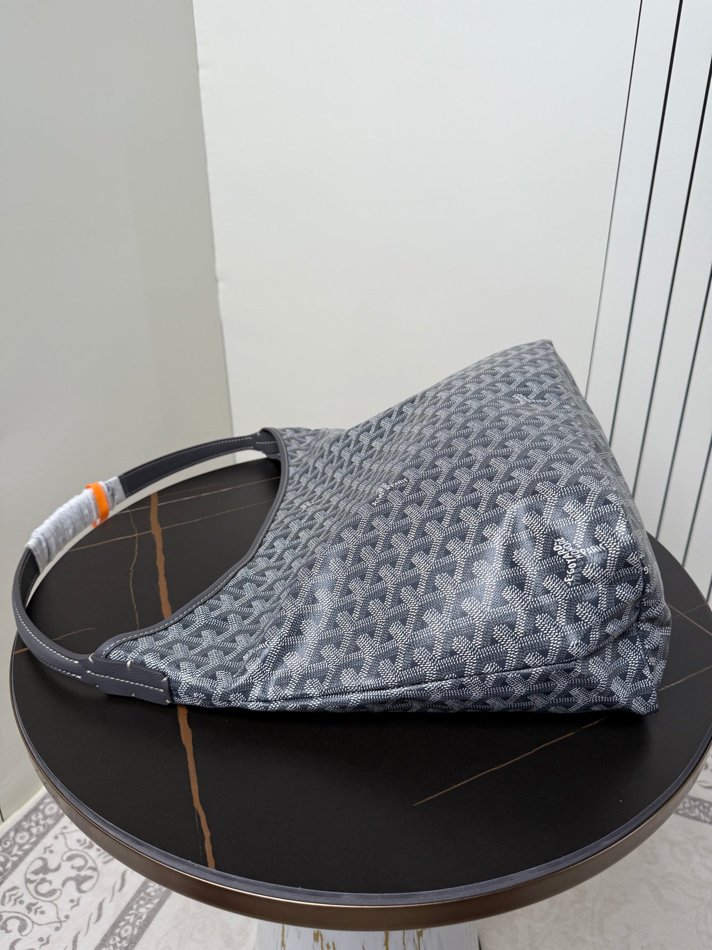 Goyard patterned hobo bag, blue-gray canvas with orange accent and top handles