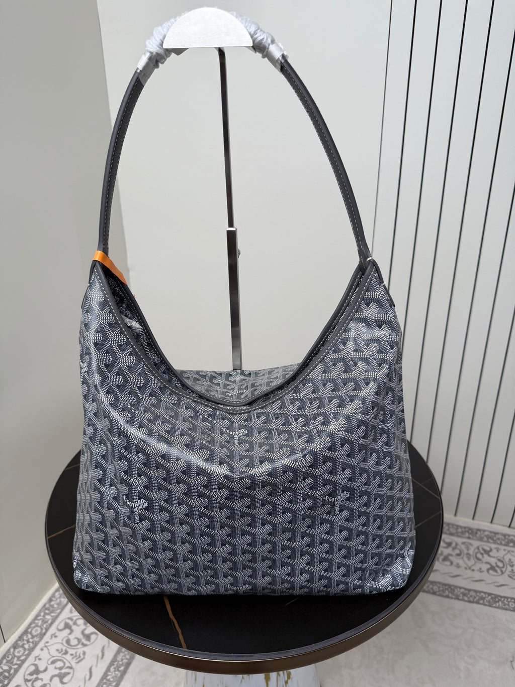 Goyard patterned hobo bag with top handles, blue-gray canvas and orange accent tab